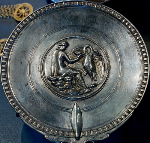 Silver, partially gilt mirror with repoussé decoration, depicting Leda and Zeus disguised as 