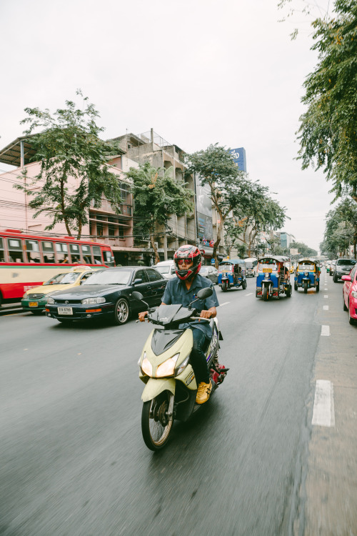 On the go in Bangkok, Thailand.SEE MORE PHOTOS LIKE THIS