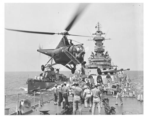 https://mewe.com/group/5fad97a87646f56ef1508812 Mail Call - Hovering over the USS Wisconsin (BB-64),