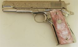 Colt 1911, chambered in .38 Super.