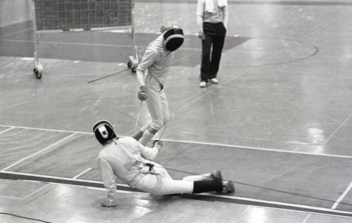 [ID: three photos of foilist in a bout. The fencer on the right is faliing over and rolling onto his