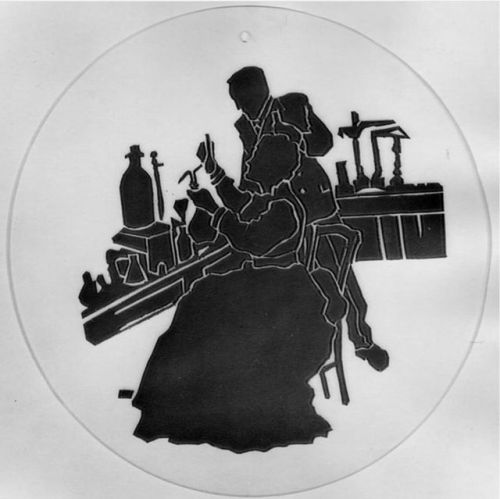 This silhouette depicts Marie and Pierre Curie working together in the lab. This photomechanical pri