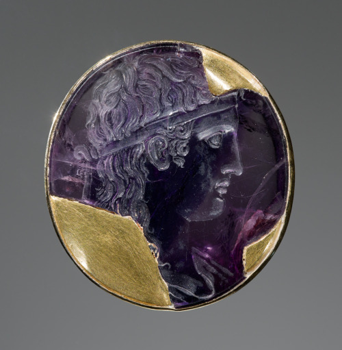 ancientjewels:Roman engraved amethyst depicting the god Apollo dating to 30-20 BCE. Gold setting is 