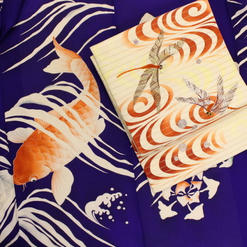 Summer kimono outfit seen on, showing koi carps among the waves and dragonflies fluttering over ripp