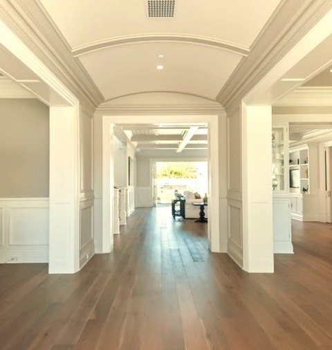 Los Angeles MudroomLarge Traditional Entryway With A Medium-toned Wood Floor, Gray Walls, And A Blue
