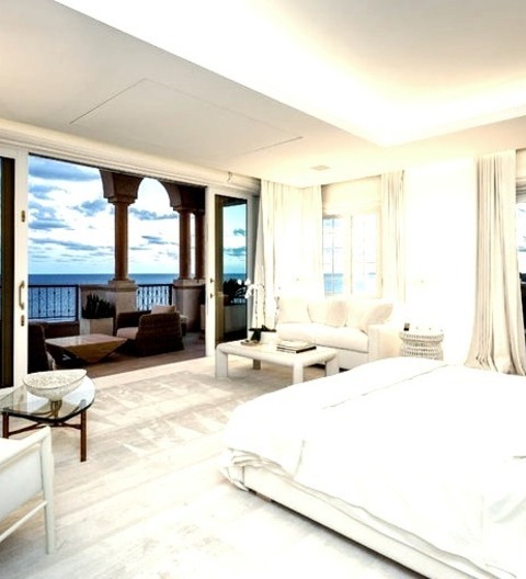 Master - BedroomExample Of A Large Master Bedroom In The Beach Style With A Yellow Floor And Carpeting,