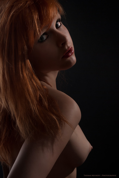 Porn photo Pretty redhead topless.