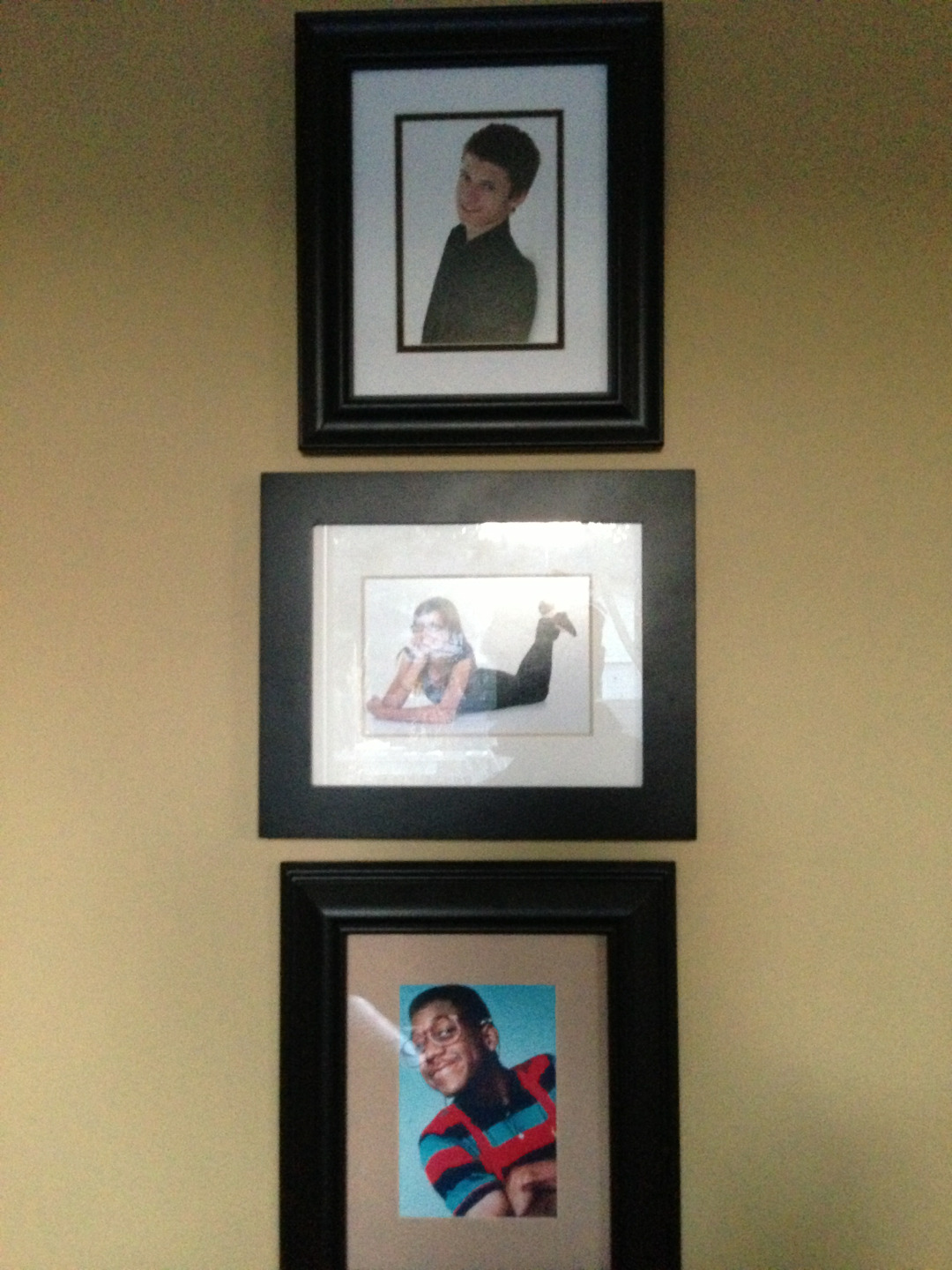 vagisodium:  theres this wall in my house with framed pictures of me and my siblings