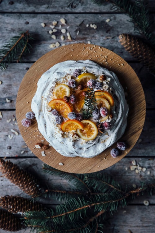 sweetoothgirl:  Christmas Pavlova w/ Sugared Cranberries and Orange & Citron Slices  