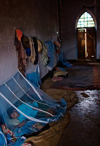 A boy sleeps in a vandalized church at a relief camp in the village of Mondesore, Odisha, on April 1