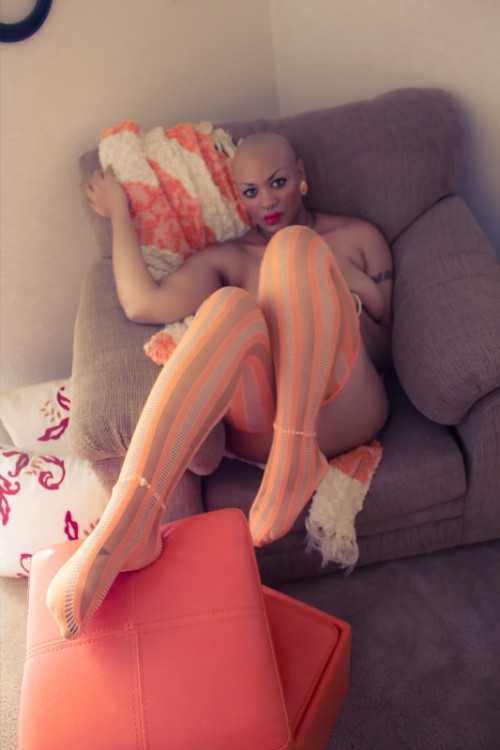 asubmissiveintraining:  nottamodel:  These photos were shot in my home. I love these orange ottomans, which serves as the accent color of my home. I saw these great orange tights while shopping online and new I had to have them. GO LIKE FAN PAGE. TRYING