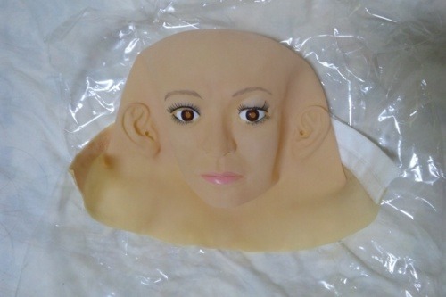 Workers of Ogawa Studios Co. are making rubber face masks of