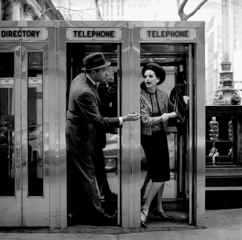 vintageeveryday:  Two models standing in adjacent phone booths, New York, 1959. Photographed by Jerry Schatzberg.