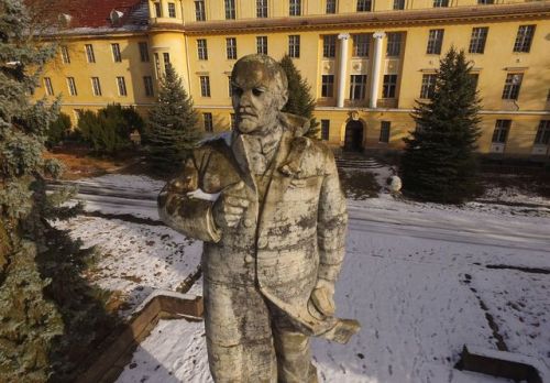 A statue of Vladimir Lenin stands in front of the officers&rsquo; building at the former Soviet mili