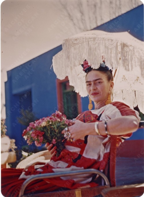 Frida Kahlo on the patio of the Blue House by Florence Arquin, 1950s
