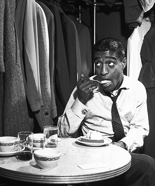 American dancer, singer and actor Sammy Davis Jr eats pound cake a la mode in his dressing room, 4th November 1953.  