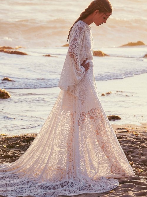 freepeople:    Completely ethereal and goddess-like, the style’s intricately embroidered sheer mesh lace, flowing hemline, and dramatic dolman sleeves add to its majesty.  Shop this dress