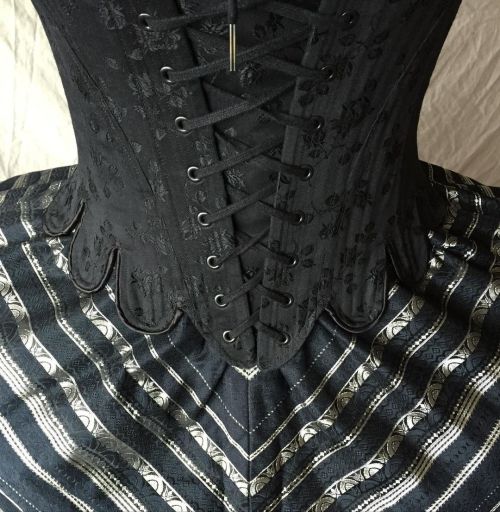 Tabs and stripes- detail of our front lacing Marie Antoinette in black brocade. #periodcorsetsbrocad