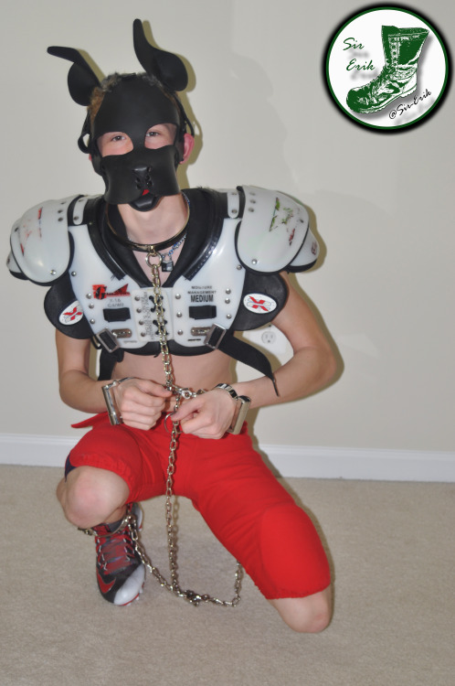 hyper-pup: This pup found some football  gear to play in! :P @sir-erik found me pupping about and had to restrain my hyper-activities with some steel cuffs 