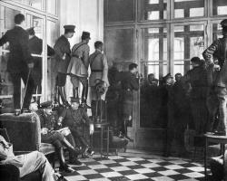 demons:  Spectators stand upon couches, tables and chairs to get even a glimpse of the Versailles Treaty being signed, 1919 