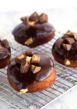 ilovedessert:  Chocolate Glazed Peanut Butter Filled Donuts