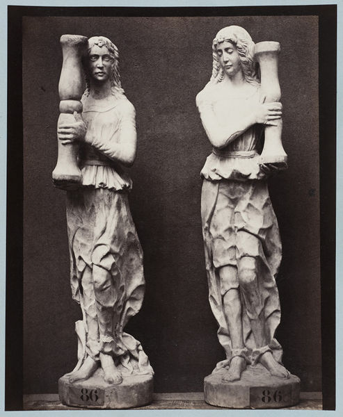 lespalimpsestes:Photograph by Louise Laffon, Marble statue of two angels holding torch bearers, part