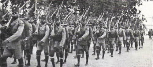 Soldiers from the Force Publique, the military force of the Belgian Congo, marches toward Ethiopia a