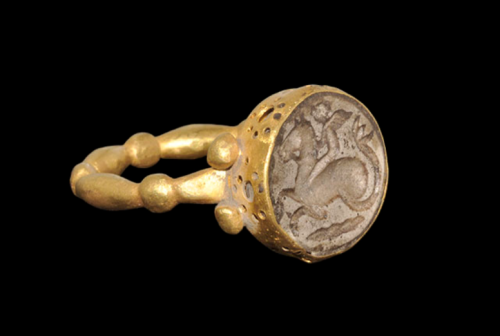 Ancient Greek gold ring with a stone intaglio of a hippocampus, dated to the 5th to 3rd centuries BC