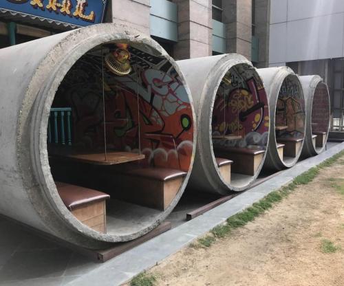 sixpenceee:   Concrete sewer pipes used as outdoor seating                              