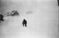 void-dance:  A student in Tiniteqilaaq, Greenland, walks home from school in a violent snow storm, 2002. Photograph by Jacob Aue Sobol. 