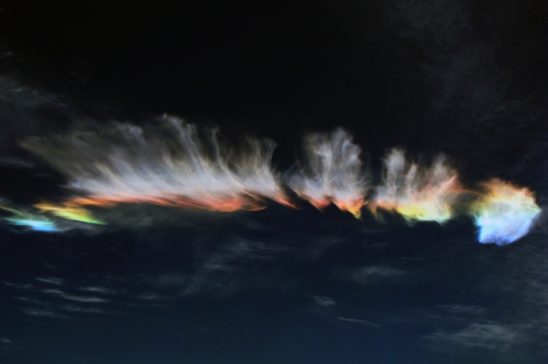 nubbsgalore:  this atmospheric phenomenon is known as a circumhorizontal arc, which occurs when the sun is at least 58° above the horizon and the hexagonal ice crystals which form cirrus clouds become horizontally aligned.                  