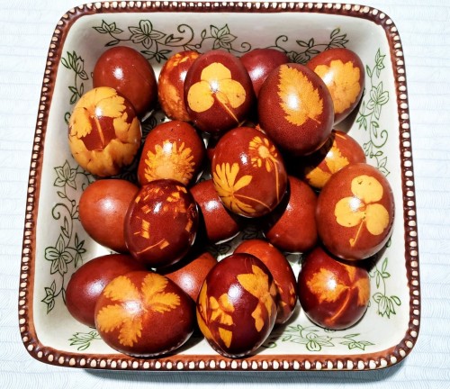 Eggs dyed with red onion skins and decorated with plants gathered from around the garden. It’s Easte