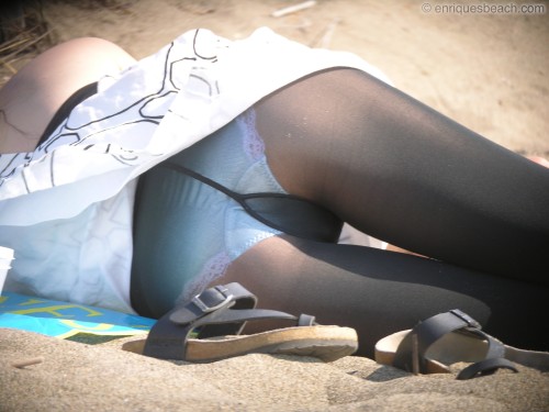 oopsembarrasing: Wonderful sight on her white panties under black pantyhose at the beach