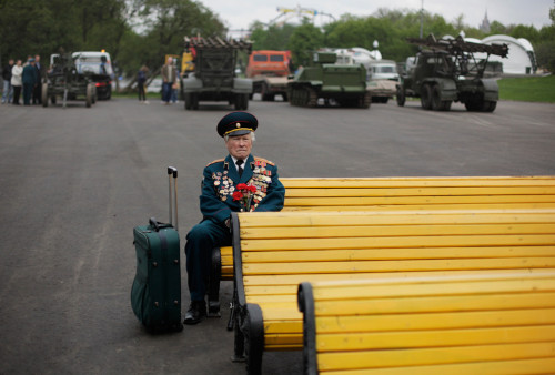 srlaissezfaire:World War II veteran from Belarus Konstantin Pronin, 86, sits on a bench as he waits 