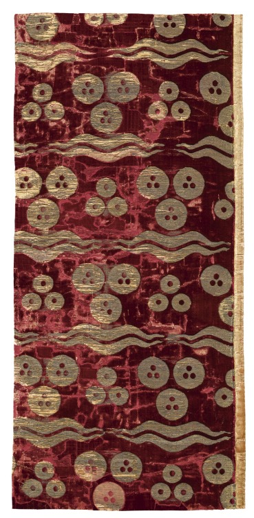 An Ottoman voided silk velvet and metal-thread textile panel, with cintamani and tiger-stripe design