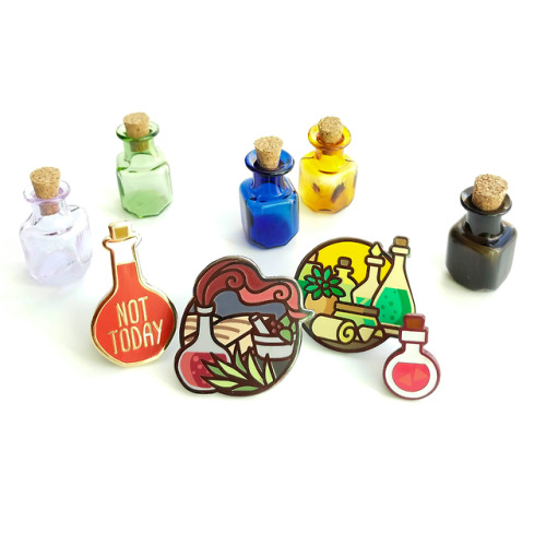 irrel:  I took a picture of all the pins I’ll have in my store featuring potions of some kind,