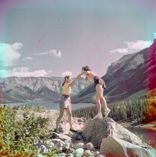 vintagecamping:A couple gals clambering over rocks at Lake MinnewankaSummer, 1951