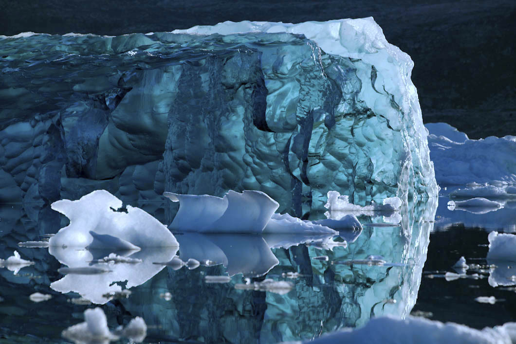 nubbsgalore:  the submerged underside of an iceberg becomes revealed when it flips,