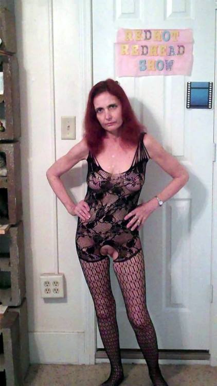 showoffmyslut:  Posing in public on a rainy day wearing her new body-stocking (and a couple indoor s