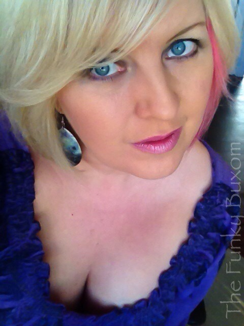 thefunkybuxom:  Pink lips and cleavage today… Gotta do what a girls gotta do. 