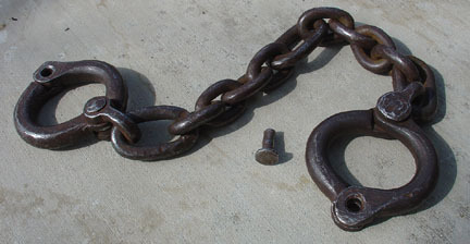 mach-d: Proper convict restraint. No wimpy padlocks here. These are riveted on for the long term (wh