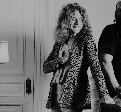 Robert Plant poses for some portraits with Peter Grant at his hotel room in New York. May 7, 1974. ©