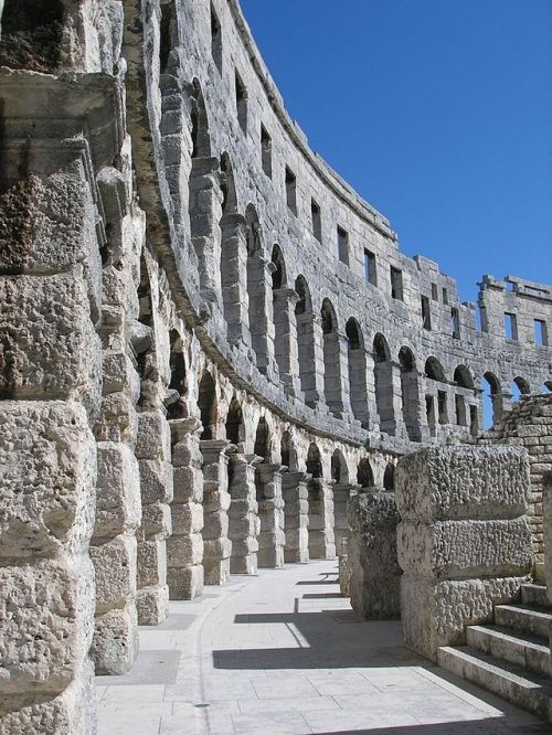 Restored arched walls of the Roman Amphitheater at Pula, Croatia. The Arena is the only remaining Ro