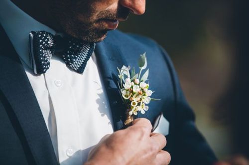 There are few things in life better than a groom in a navy suit, bowtie and extra cute buttonhole!&n