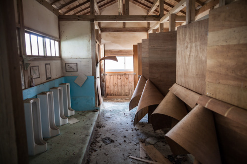 Restrooms sans plumbing at a forgotten wooden school in the back mountains of Western Japan. More im