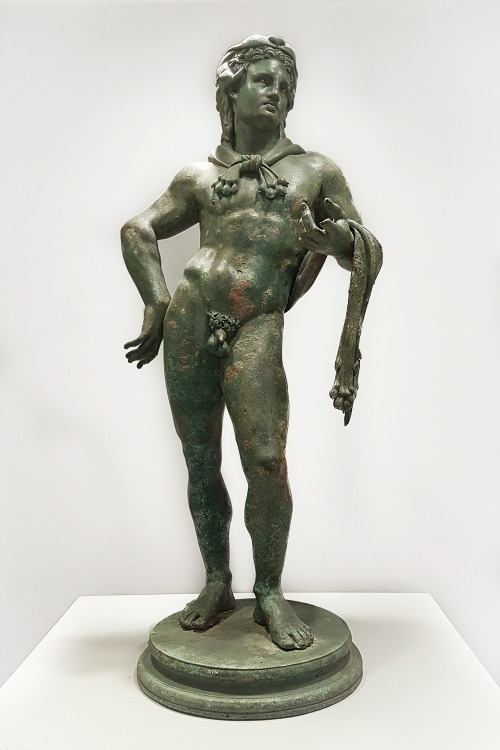 Bronze statuette of Herakles on a round base. The hero wears the lion’s skin.Work of the 1st c. AC i