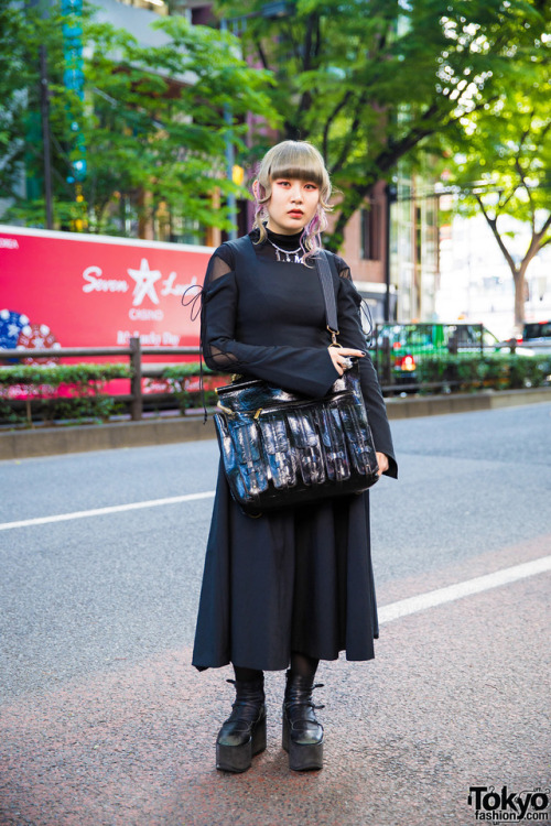 20-year-old Japanese fashion student Hazuki on the street in Harajuku wearing a gothic inspired stre