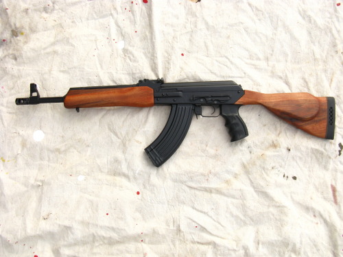 gunrunnerhell:  Improvise… Vepr rifles on the market have slant cut receivers. This makes it difficult to use standard AK stocks, but not impossible. Generally they come configured with a wooden thumbhole stock but the one in the photo has had the pistol