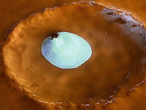 spaceexp: What lies on the floor of this Martian crater? …A frozen patch of water ice. The robotic Mars Express spacecraft took the above image in early February. The ice pocket was found in a 35-kilometer wide crater that resides 70 degrees north of