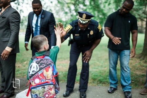 cleophatracominatya:nousverrons:Nearly 100 black men greeted children at an elementary school in Har